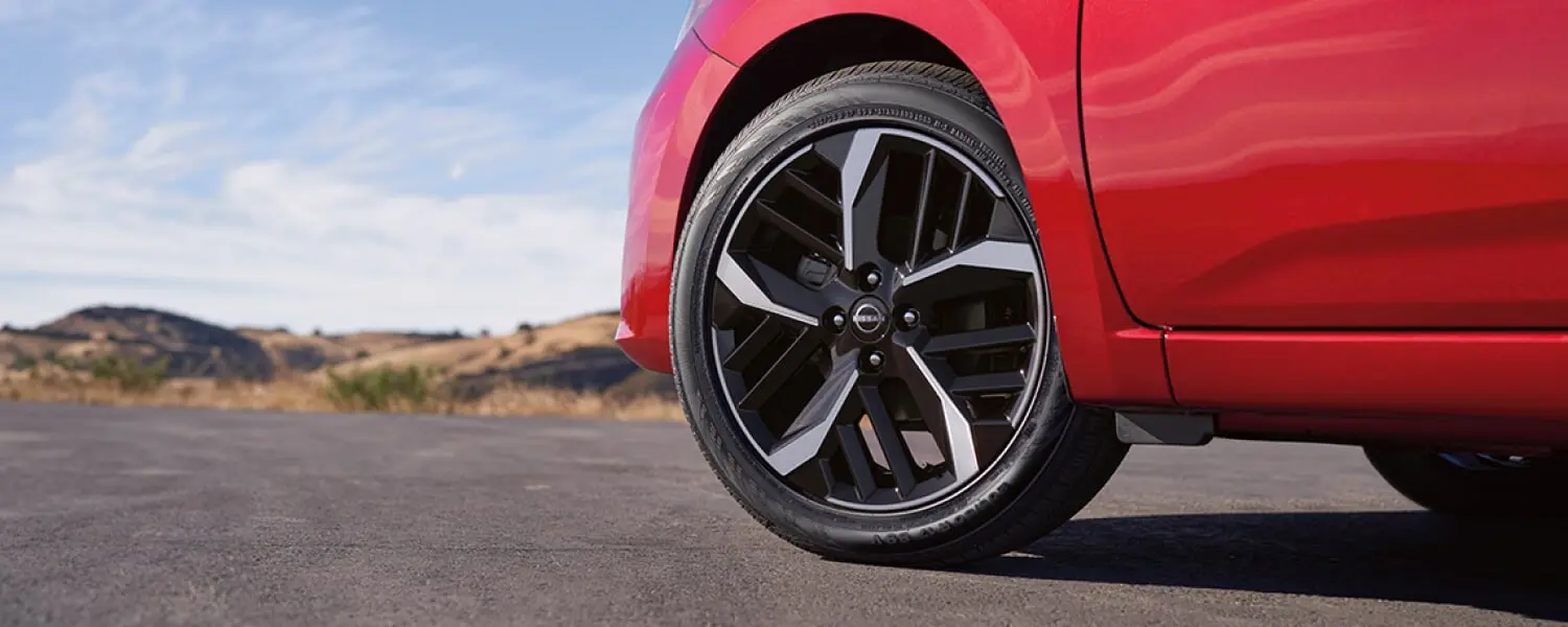 2025 nissan versa detail view of 17 machine finished aluminum alloy wheels